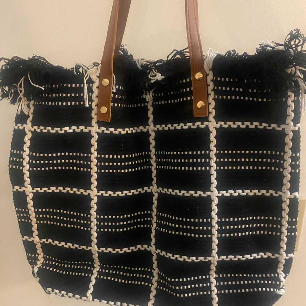 Black & White woven canvas tote bag w/fringe detailing and brown leather handles